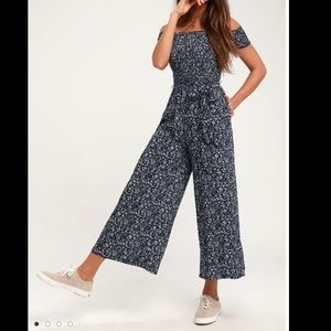 Lulu‘s navy blue floral print off the shoulder jumpsuit